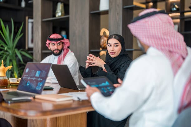 Business team in Saudi Arabia reviewing dashboards during a meeting